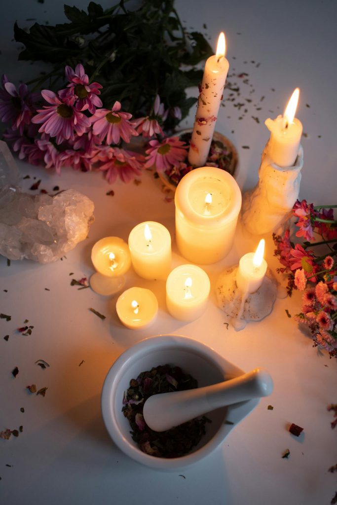 Texas Best Female Witch Doctor: When You Need Answers Quickly - Mortar and pestle by burning candles