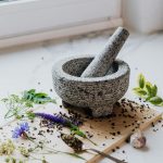 USA Traditional Healer - Traditional Healing for Relationship Problems - Mortar and pestle with flowers, leaves and seeds