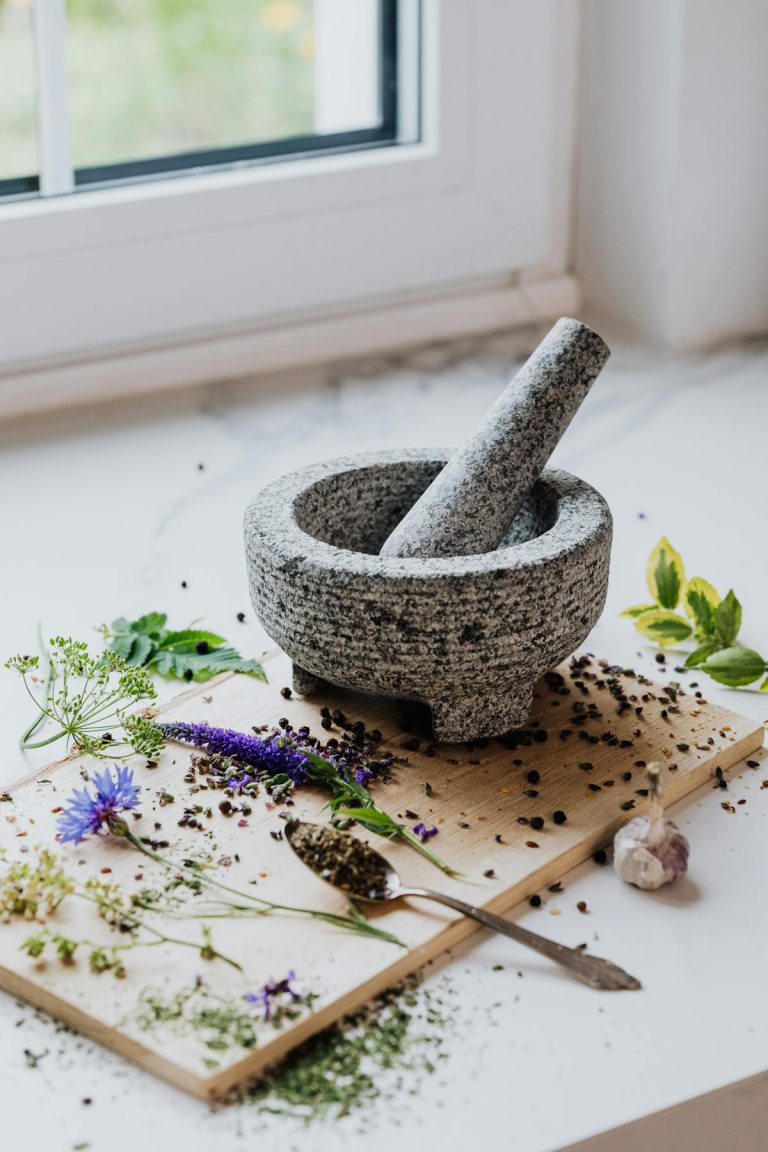 USA Traditional Healer - Traditional Healing for Relationship Problems - Mortar and pestle with flowers, leaves and seeds